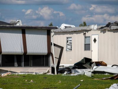 Florida Southwest region after hurricane season. Collapsed and damaged mobile homes in rural residential area. Consequences of severe natural disaster.