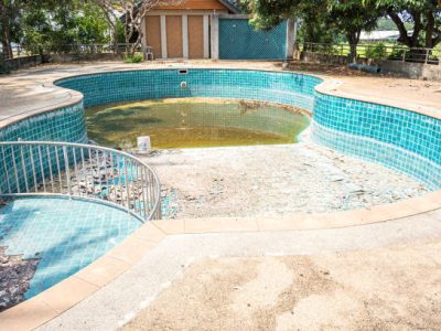 Abandoned swimming pool in the garden house.